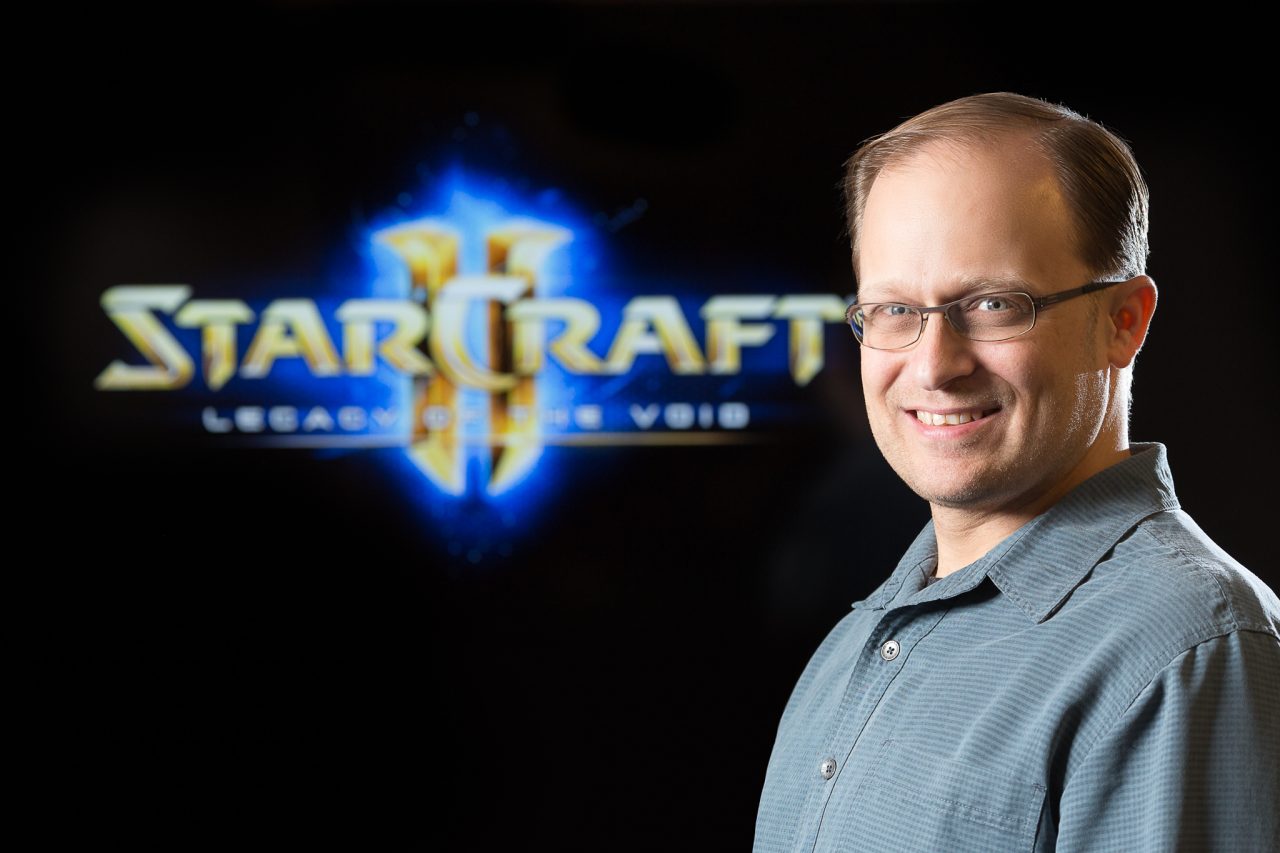 Portrait of a Blizzard Entertainment staff member with a StarCraft II: Legacy of the Void backdrop.
