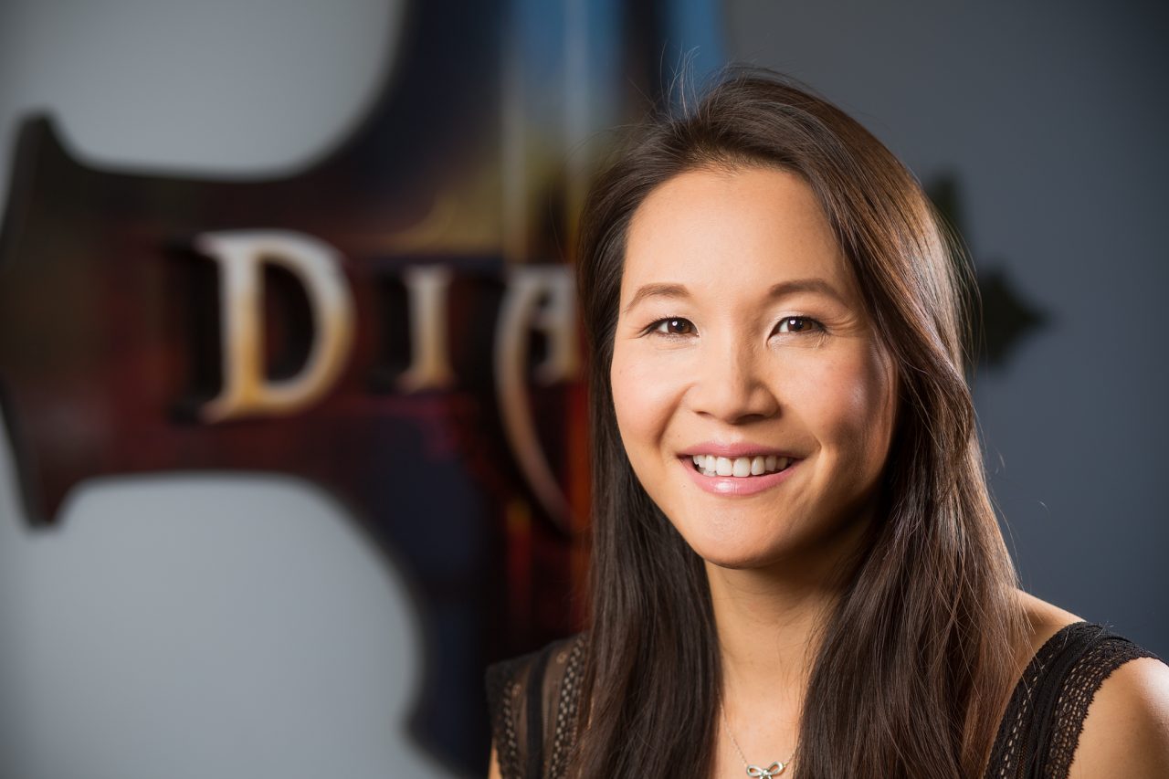Headshot of a Blizzard Entertainment staff member with a Diablo backdrop.