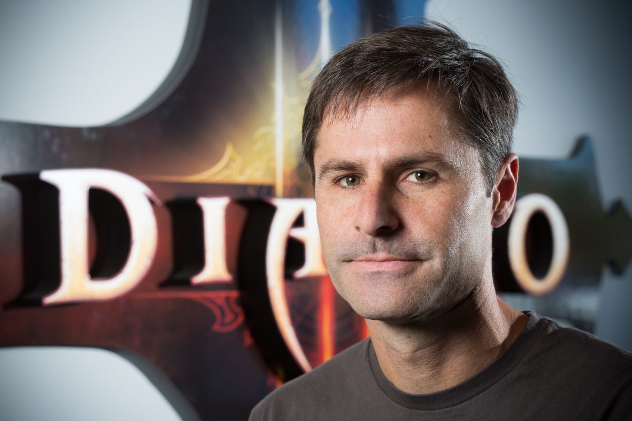 Headshot of a Blizzard Entertainment staff member with a Diablo-themed backdrop.
